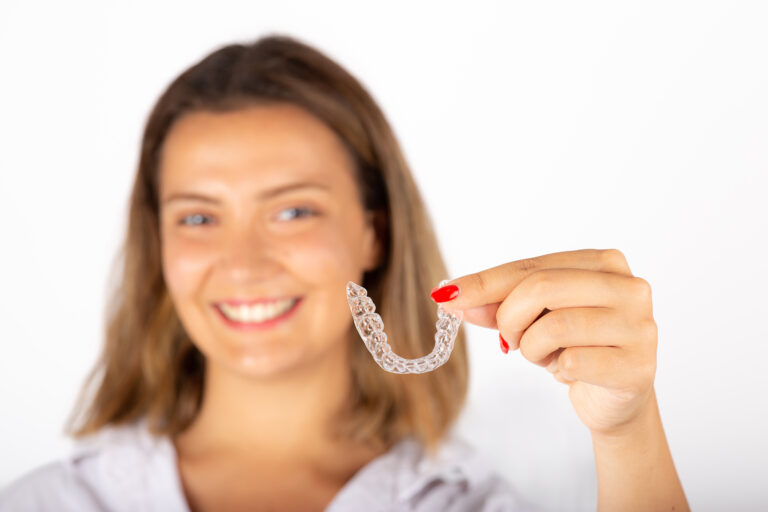 Invisalign Slowly Changes Your Smile, Here's What to Look For