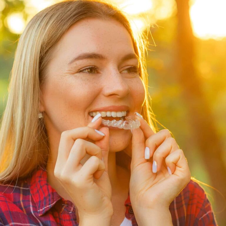 White Smile. Portrait Of Beautiful Smiling Woman With Healthy Straight White Teeth Holding Teeth Whitening Tray, Girl Using Dental Whitener.